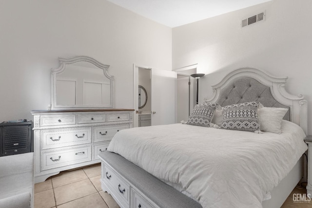 bedroom with light tile patterned floors and visible vents