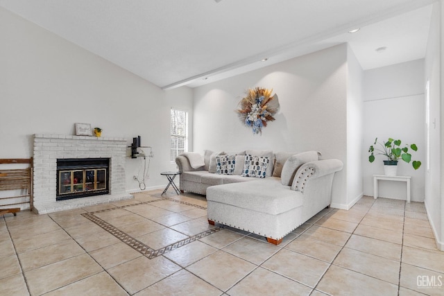 living room featuring a brick fireplace, baseboards, and light tile patterned flooring