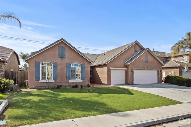 view of front of house with a garage and a front yard