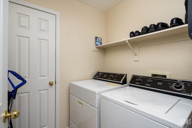 clothes washing area featuring washing machine and clothes dryer