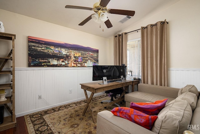 home office with hardwood / wood-style flooring, ceiling fan, and lofted ceiling