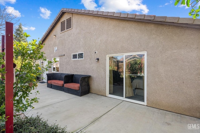 rear view of property featuring a patio