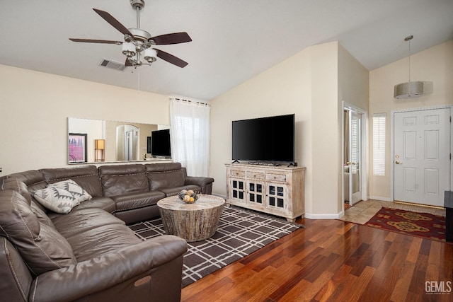 living room featuring ceiling fan, high vaulted ceiling, and hardwood / wood-style floors