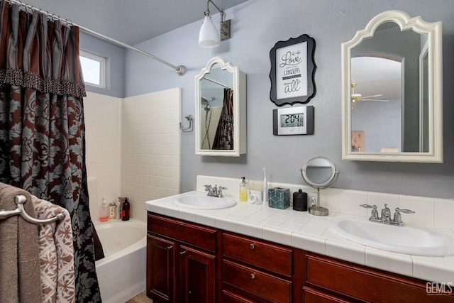 bathroom with vanity, shower / bath combination with curtain, and ceiling fan