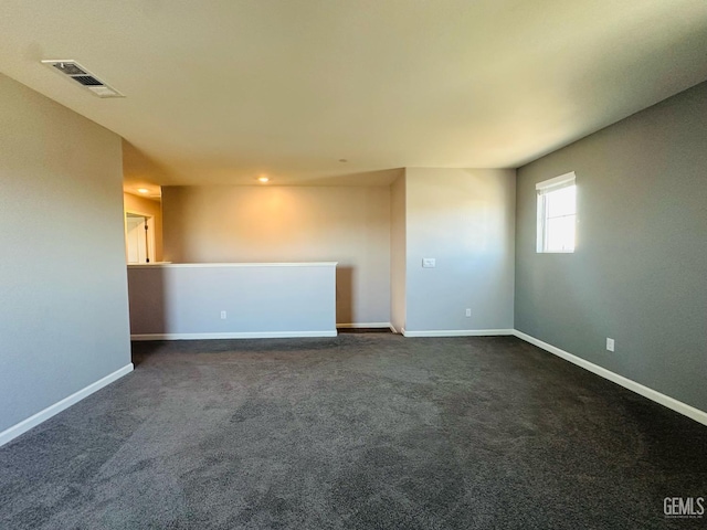 5910 Bogart Dr, Bakersfield, CA 93313 - spare room with dark colored carpet