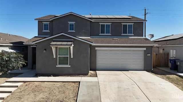 5910 Bogart Dr, Bakersfield, CA 93313 - traditional-style home featuring solar panels, an attached garage, stucco siding, driveway, and roof with shingles