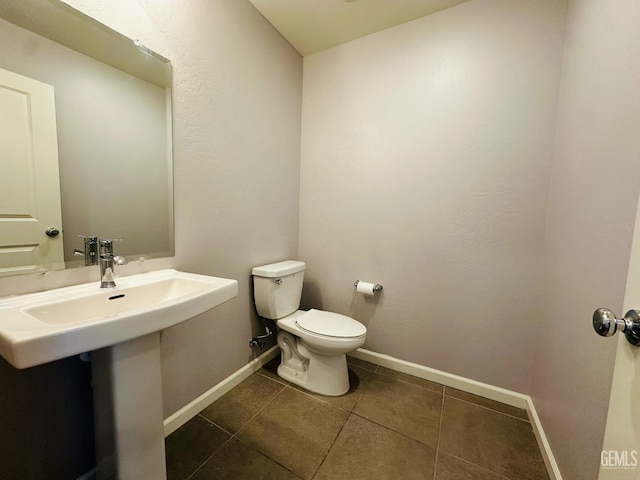 5910 Bogart Dr, Bakersfield, CA 93313 - half bath with tile patterned flooring and toilet