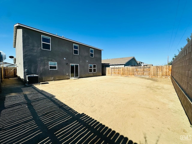 5910 Bogart Dr, Bakersfield, CA 93313 - rear view of property with a fenced backyard and stucco siding