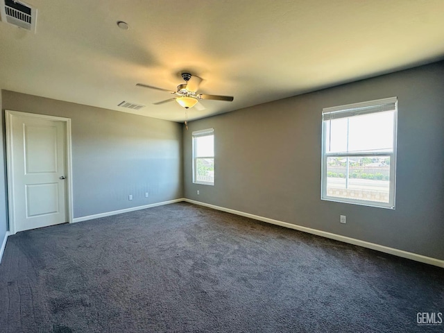 5910 Bogart Dr, Bakersfield, CA 93313 - unfurnished room with a ceiling fan and dark carpet