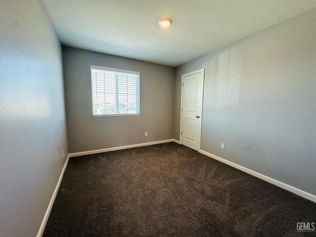 5910 Bogart Dr, Bakersfield, CA 93313 - unfurnished room featuring dark colored carpet