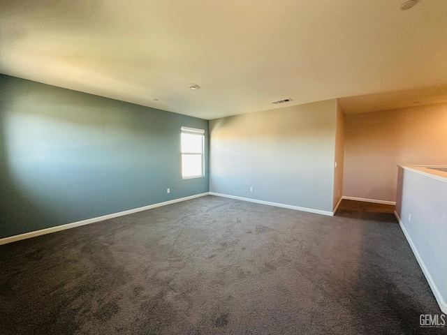 5910 Bogart Dr, Bakersfield, CA 93313 - unfurnished room featuring dark colored carpet