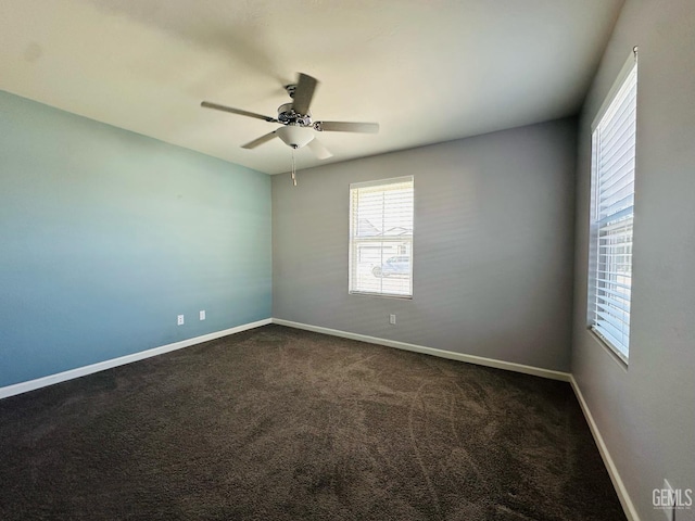5910 Bogart Dr, Bakersfield, CA 93313 - empty room featuring healthy amount of natural light, ceiling fan, and dark carpet