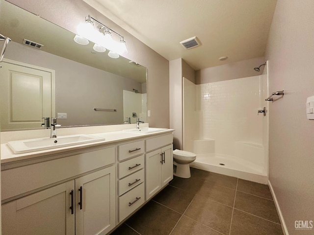 5910 Bogart Dr, Bakersfield, CA 93313 - full bathroom with tile patterned floors, double vanity, and a shower