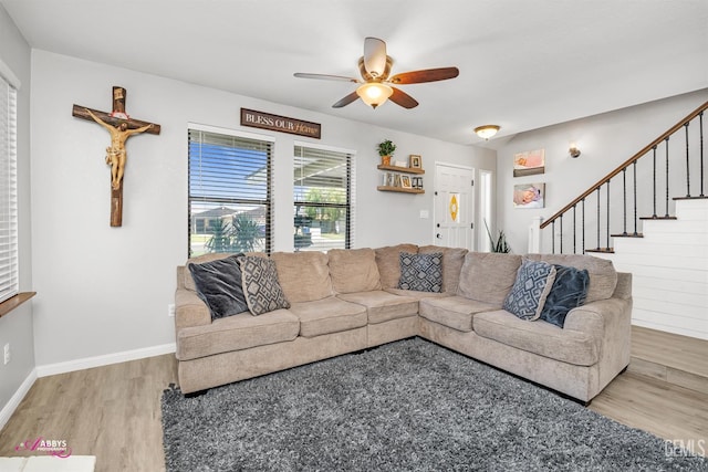 11265 Poulsen Way, Bakersfield, CA 93312 - living room featuring wood finished floors, a ceiling fan, and stairway