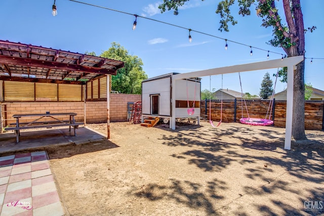 11265 Poulsen Way, Bakersfield, CA 93312 - fenced backyard featuring exterior structure and an outdoor structure