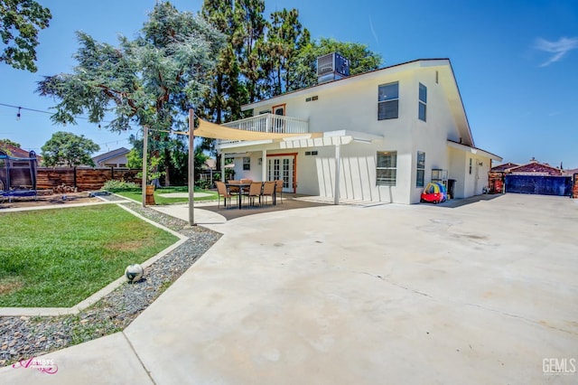 11265 Poulsen Way, Bakersfield, CA 93312 - rear view of property featuring stucco siding, a patio area, and french doors