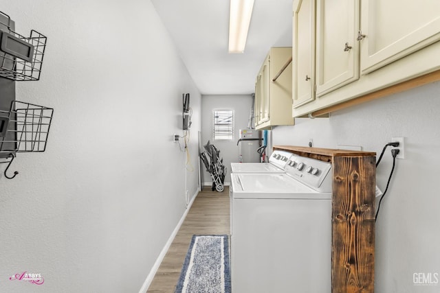 11265 Poulsen Way, Bakersfield, CA 93312 - laundry area featuring cabinet space, washing machine and clothes dryer, light wood-style flooring, and secured water heater