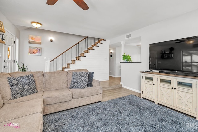 11265 Poulsen Way, Bakersfield, CA 93312 - living room featuring a ceiling fan, wood finished floors, and stairs