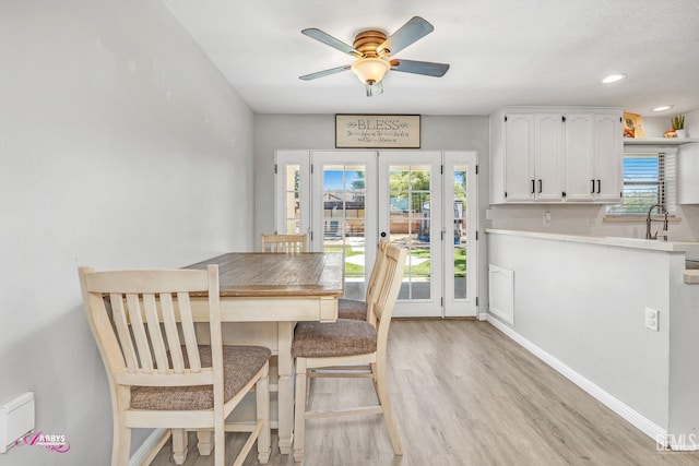 11265 Poulsen Way, Bakersfield, CA 93312 - dining space featuring french doors, light wood-style floors, a ceiling fan, and recessed lighting