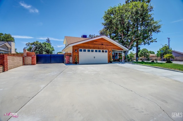 11265 Poulsen Way, Bakersfield, CA 93312 - view of front of home featuring a garage, concrete driveway, and a gate
