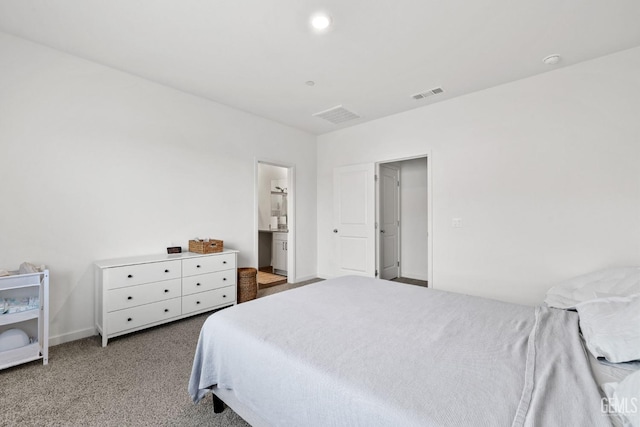 carpeted bedroom with visible vents and baseboards