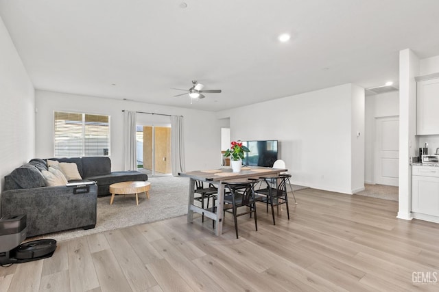 dining room with recessed lighting, a ceiling fan, and light wood finished floors