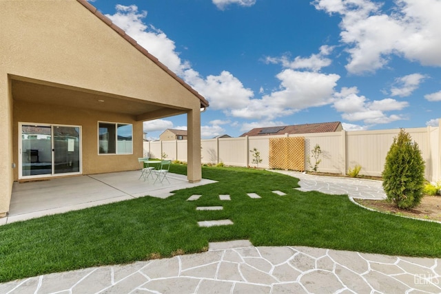 view of yard featuring a patio and a fenced backyard