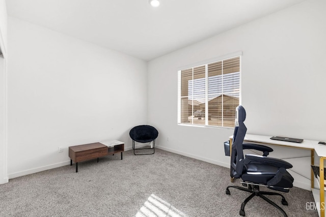 carpeted office featuring baseboards