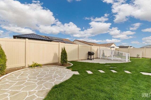 view of yard with a fenced backyard and a patio