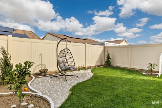 view of yard featuring a patio area and a fenced backyard