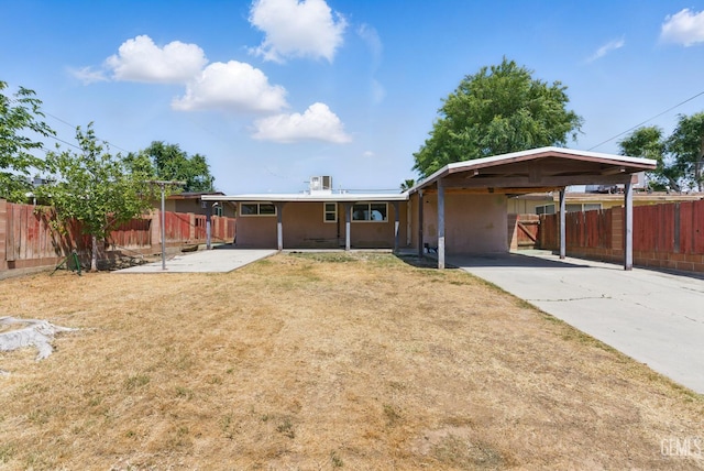 2804 Haley St, Bakersfield, CA 93305 - rear view of property with fence and concrete driveway