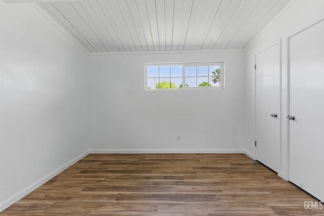 2804 Haley St, Bakersfield, CA 93305 - unfurnished bedroom with wood ceiling, wood finished floors, and baseboards