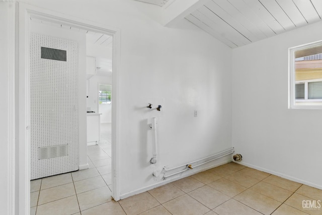2804 Haley St, Bakersfield, CA 93305 - clothes washing area with light tile patterned floors, hookup for a gas dryer, a heating unit, baseboards, and washer hookup