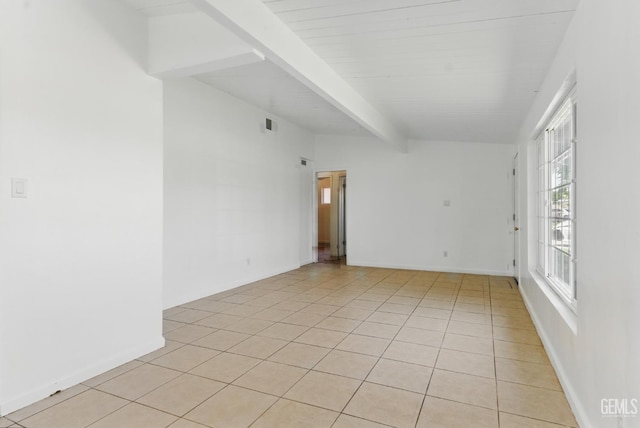 2804 Haley St, Bakersfield, CA 93305 - unfurnished room with beam ceiling, light tile patterned floors, and baseboards