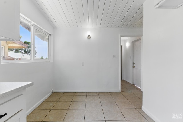 2804 Haley St, Bakersfield, CA 93305 - empty room with baseboards, light tile patterned floors, and an AC wall unit
