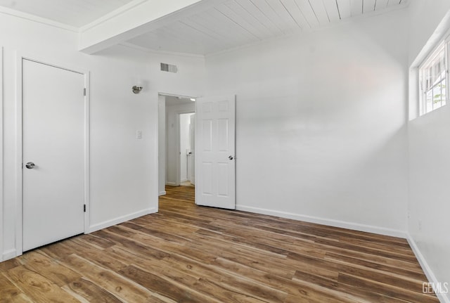 2804 Haley St, Bakersfield, CA 93305 - unfurnished bedroom featuring wood finished floors, baseboards, wooden ceiling, beam ceiling, and crown molding