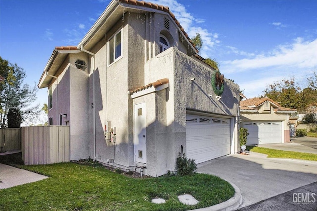 view of side of property with a garage