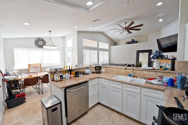 7519 Shadow Wells St, Bakersfield, CA 93313 - kitchen with stainless steel dishwasher, plenty of natural light, tasteful backsplash, a ceiling fan, and vaulted ceiling
