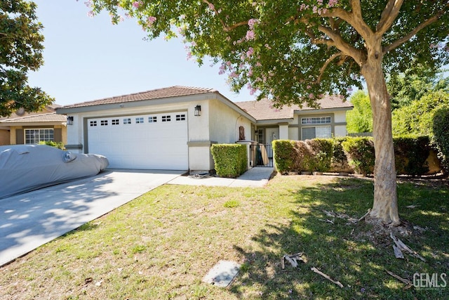 7519 Shadow Wells St, Bakersfield, CA 93313 - single story home with an attached garage, stucco siding, concrete driveway, and a front yard