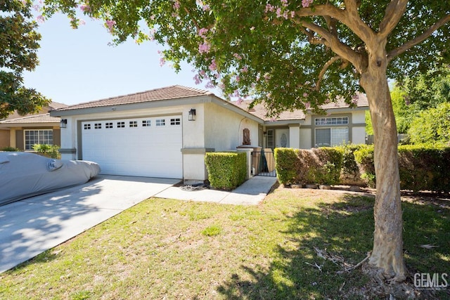 7519 Shadow Wells St, Bakersfield, CA 93313 - ranch-style home featuring stucco siding, a garage, driveway, and a front lawn
