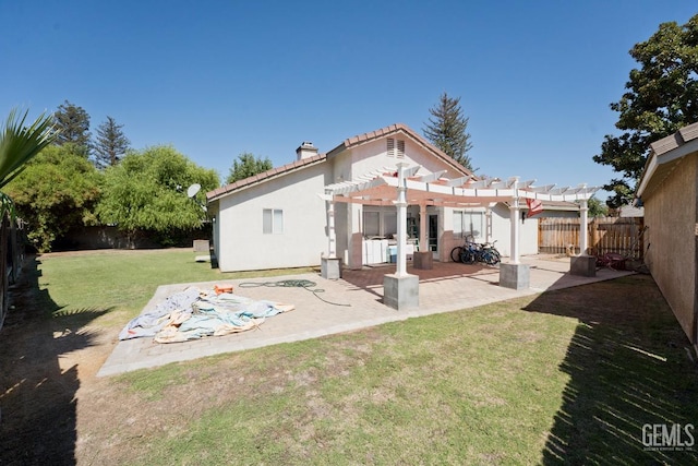 7519 Shadow Wells St, Bakersfield, CA 93313 - back of property with a pergola, a patio area, a fenced backyard, a chimney, and stucco siding