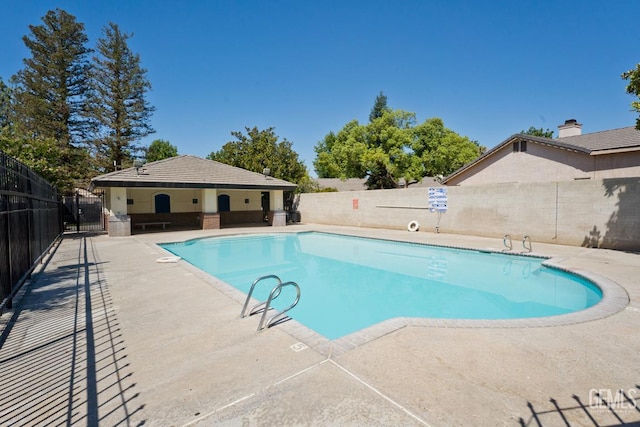 7519 Shadow Wells St, Bakersfield, CA 93313 - community pool featuring a patio area