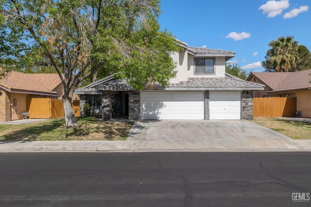 1224 N Mayflower Cir, Ridgecrest, CA 93555 - obstructed view of property with stone siding, a garage, a tiled roof, fence, and concrete driveway