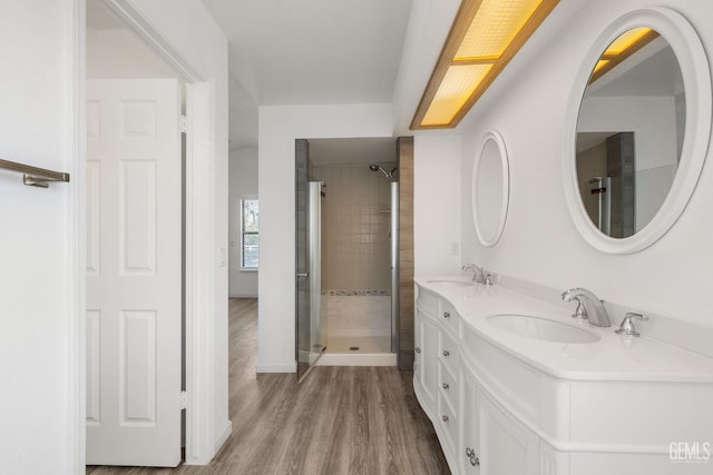 1224 N Mayflower Cir, Ridgecrest, CA 93555 - bathroom with a shower stall, double vanity, a sink, and wood finished floors