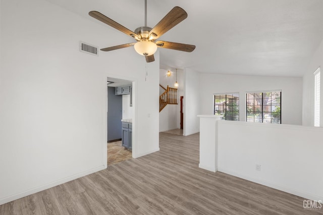 1224 N Mayflower Cir, Ridgecrest, CA 93555 - unfurnished room featuring visible vents, baseboards, ceiling fan, light wood-style floors, and vaulted ceiling