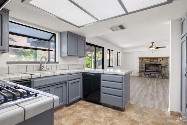 1224 N Mayflower Cir, Ridgecrest, CA 93555 - kitchen featuring a sink, a peninsula, black dishwasher, visible vents, and ceiling fan