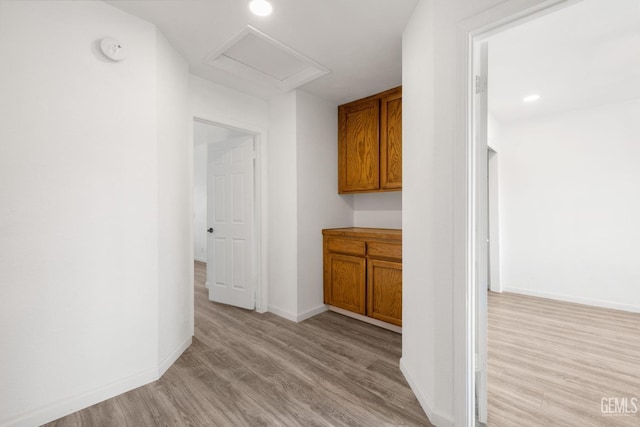 1224 N Mayflower Cir, Ridgecrest, CA 93555 - hallway with baseboards, recessed lighting, light wood-style flooring, and attic access
