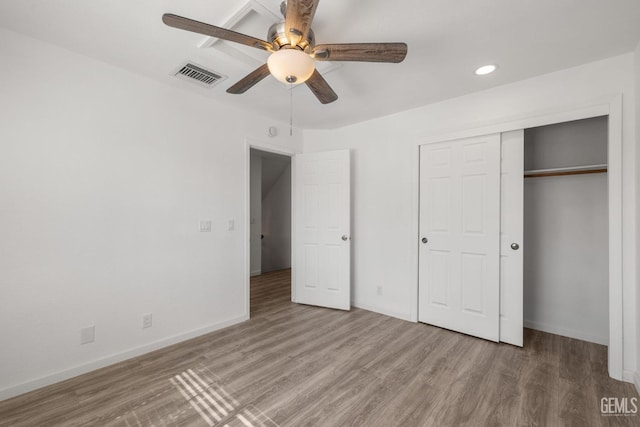 1224 N Mayflower Cir, Ridgecrest, CA 93555 - unfurnished bedroom with baseboards, a closet, visible vents, and wood finished floors