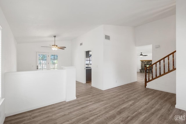 1224 N Mayflower Cir, Ridgecrest, CA 93555 - empty room featuring vaulted ceiling, a ceiling fan, visible vents, and wood finished floors