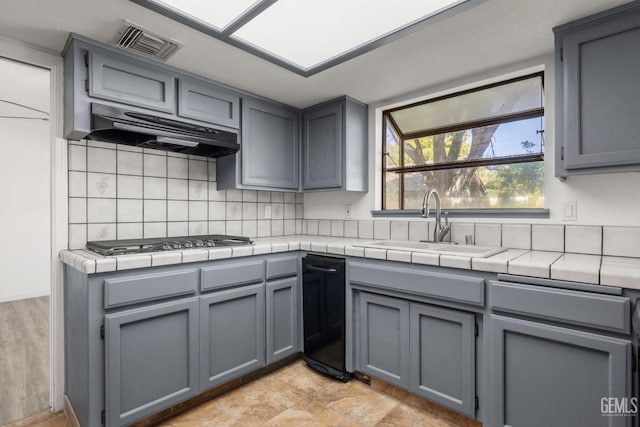 1224 N Mayflower Cir, Ridgecrest, CA 93555 - kitchen with under cabinet range hood, gray cabinets, visible vents, and a sink